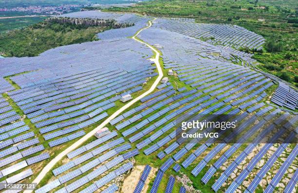 Aerial view of solar panels at a photovoltaic power station on July 19, 2023 in Zaozhuang, Shandong Province of China.