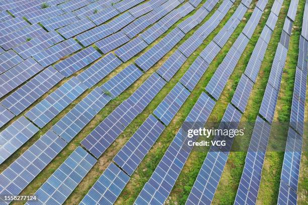 Aerial view of solar panels at a photovoltaic power station on July 19, 2023 in Zaozhuang, Shandong Province of China.