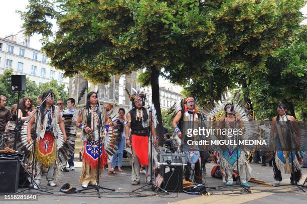 Band dressed with Indian native American suits perform on June 21, 2009 in Paris during the annual music event, "La Fete de la Musique". Thousands of...
