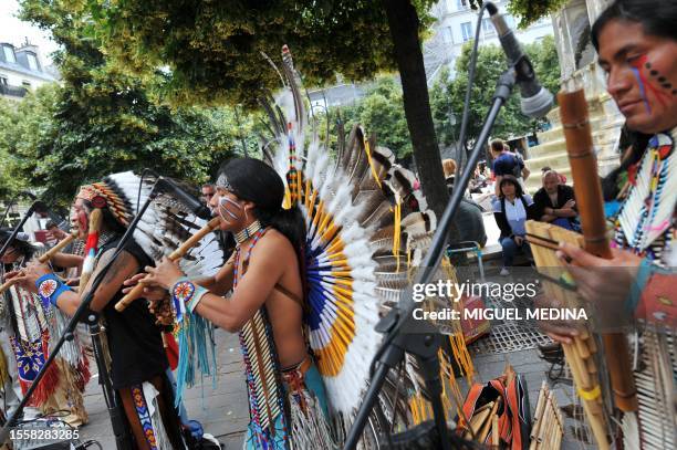 Band dressed with Indian native American suits perform on June 21, 2009 in Paris during the annual music event, "La Fete de la Musique". Thousands of...