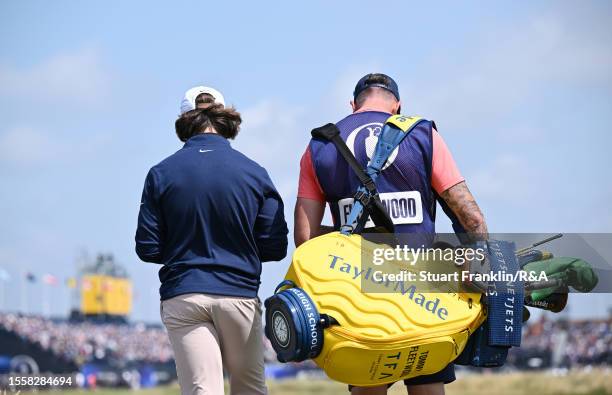 Tommy Fleetwood of England looks on alongside caddy Ian Finnis during Day One of The 151st Open at Royal Liverpool Golf Club on July 20, 2023 in...