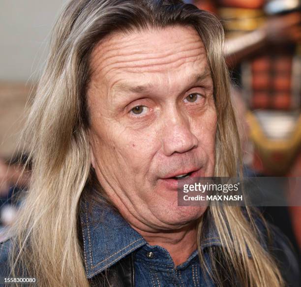 Iron Maiden drummer Nicko McBrain arrives in Kensington, London to attend the premiere of the film, Flight 666, made about the group, on April 20,...