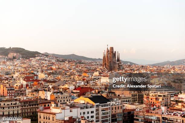 barcelona cityscape with sagrada familia at sunset, catalonia, spain - sagrada familia barcelona stock pictures, royalty-free photos & images