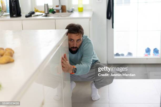 man checking level surface indoors - counter surface level stock pictures, royalty-free photos & images