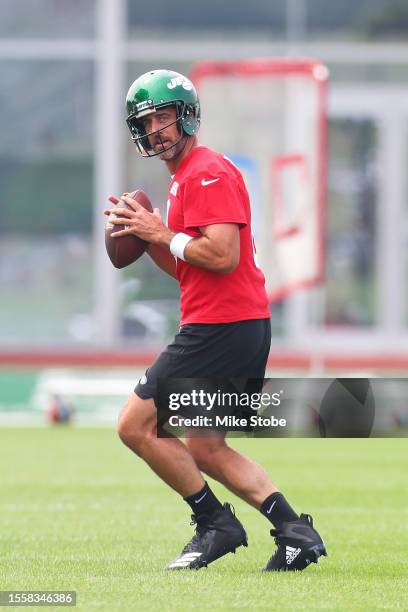 Aaron Rodgers of the New York Jets run drills during training camp at Atlantic Health Jets Training Center on July 20, 2023 in Florham Park, New...