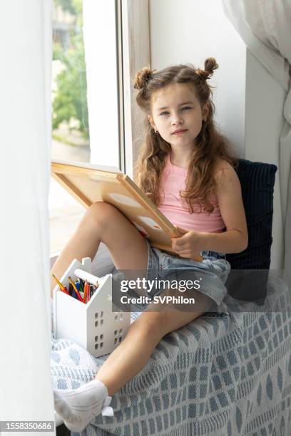 Sketch book and pencils on a windowsill Stock Photo - Alamy