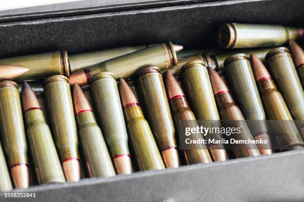 ammo box with 7.62 mm cartridges for kalashnikov assault rifle - kalashnikov fotografías e imágenes de stock