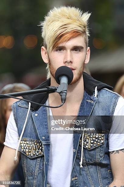 Singer / television personality Colton Dixon performs on EXTRA at The Grove on November 8, 2012 in Los Angeles, California.