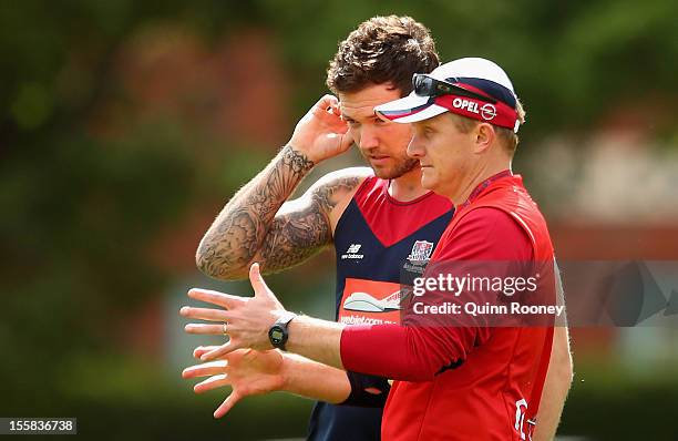 Mark Neeld the coach of the Demons speaks to Mitch Clark during a Melbourne Demons AFL training session at Gosch's Paddock on November 9, 2012 in...