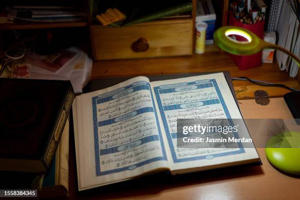 qur'an open on table at home - opening week stock pictures, royalty-free photos & images