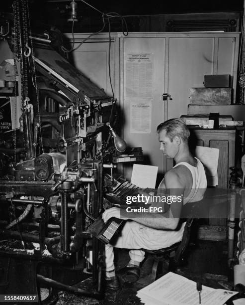 American printworker Tom Looney, a Linotype machine operator preparing a county newspapers, United States, circa 1955. The Linotype machine is a hot...