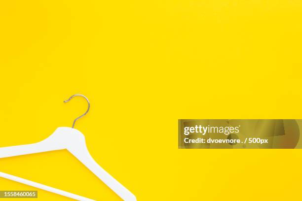 white hangers background for sale shopping concept,pula,croatia - editorial template stock pictures, royalty-free photos & images