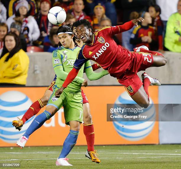 Kenny Mansally of Real Salt Lake heads the ball past Fredy Montero of the Seattle Sounders during the first half of an MLS Western Conference...