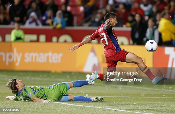 Paulo Araujo Jr. #23 of Real Salt Lake takes the ball from Jeff Parke of the Seattle Sounders during the first half of an MLS Western Conference...