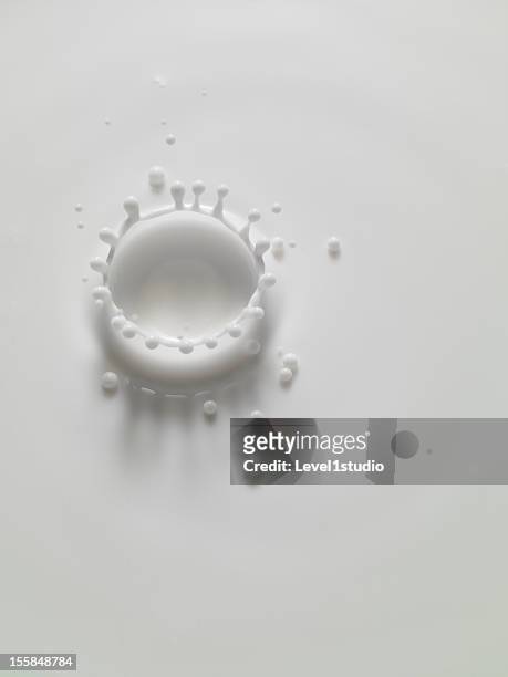 milk crown - dripping milk stock pictures, royalty-free photos & images
