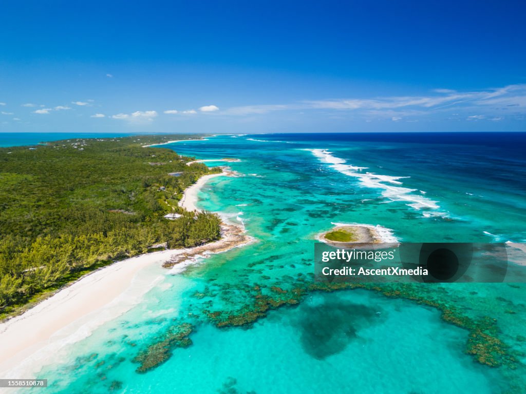 Aerial scenic view of white sand beaches and turquoise water