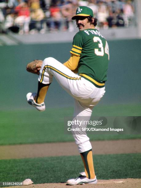 Rollie Fingers of the Oakland Athletics throws a pitch during a game at Oakland-Alameda County Coliseum circa 1974 in Oakland, California.