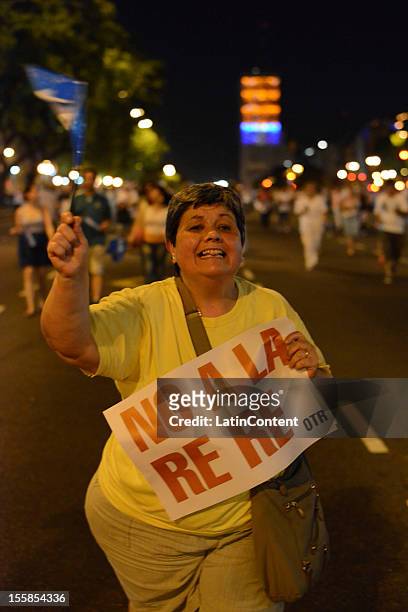 Argentinian citizen holds a poster during a protest against the government of Cristina Kirchner at Plaza de Mayo on November 08, 2012 in Buenos...