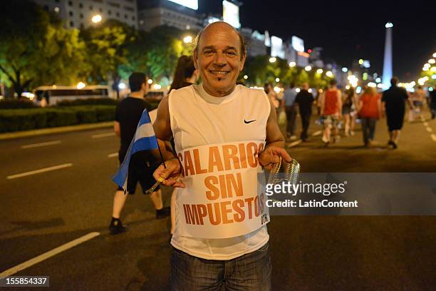 Argentinian citizen holds a poster during a protest against the government of Cristina Kirchner at Plaza de Mayo on November 08, 2012 in Buenos...
