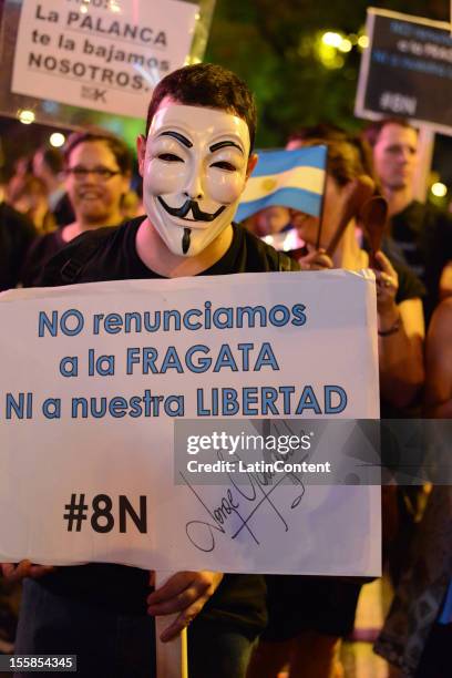 Argentinian citizen holds a poster during a protest against the government of Cristina Kirchner at Plaza de Mayo on November 08, 2012 in Buenos...