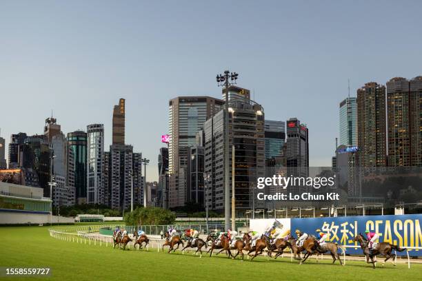 Jockeys compete in the Race 2 Sweet Orange Handicap at Happy Valley Racecourse on July 12, 2023 in Hong Kong.