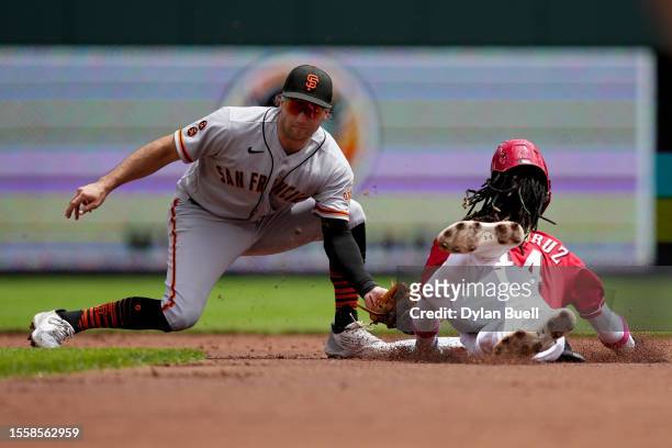 Casey Schmitt of the San Francisco Giants tags out Elly De La Cruz of the Cincinnati Reds at second base during a stolen base attempt at Great...