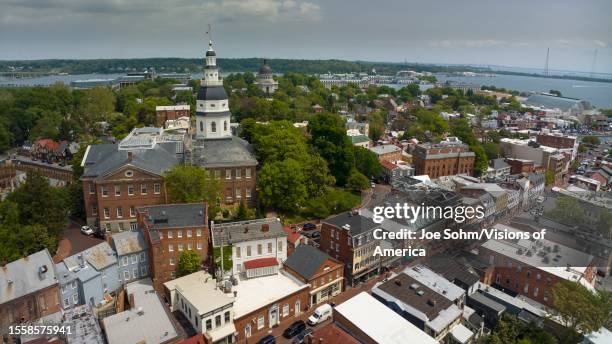 Aerial view of Annapolis State Capitol of Maryland with US Naval Academy in background on Chesapeake River.