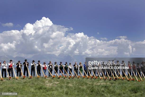 More than 120 Alphorn blowers perform the ensemble pieces during the 5th International Alphorn Festival taking place in Nendaz over the week-end, 23...