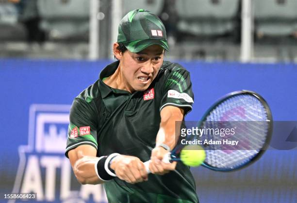 Kei Nishikori of Japan hits a shot against Juncheng Shang during the second round of the ATP Atlanta Open at Atlantic Station on July 27, 2023 in...
