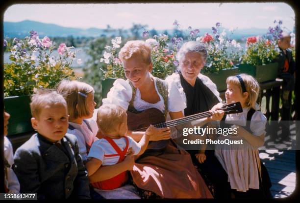 American actress Mary Martin sings with teacher and author Maria von Trapp , and some of the latter's grandchildren, Stowe, Vermont, August 1959. At...