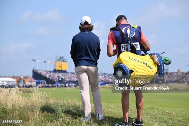 Tommy Fleetwood of England looks on alongside caddy Ian Finnis during Day One of The 151st Open at Royal Liverpool Golf Club on July 20, 2023 in...