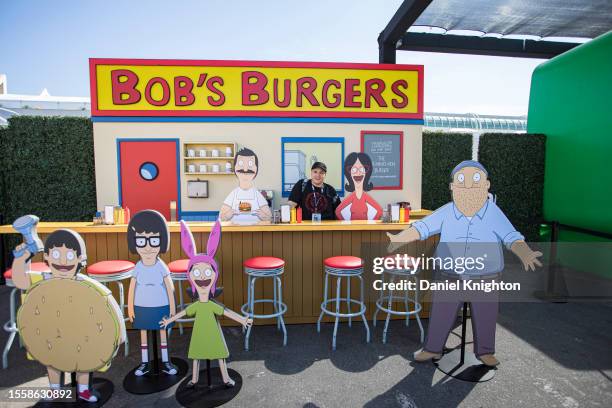 Attendee Nicholas Gonzalez poses at the Bob's Burgers display during Hulu Animayhem: Enter The 2nd Dimension press preview on July 20, 2023 in San...