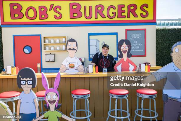 Attendee Nicholas Gonzalez poses at the Bob's Burgers display during Hulu Animayhem: Enter The 2nd Dimension press preview on July 20, 2023 in San...