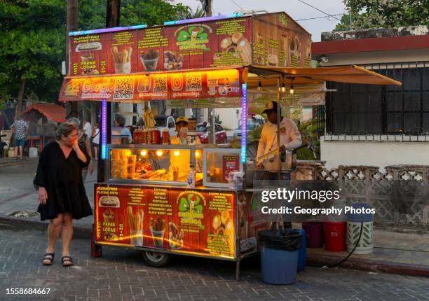 Fast food churros stall at night, Isla Mujeres, Caribbean Coast, Cancun, Quintana Roo, Mexico.