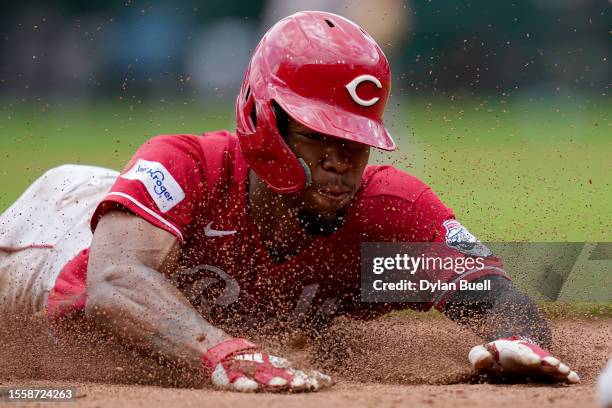 Will Benson of the Cincinnati Reds slides into third base for a stolen base in the sixth inning against the San Francisco Giants at Great American...