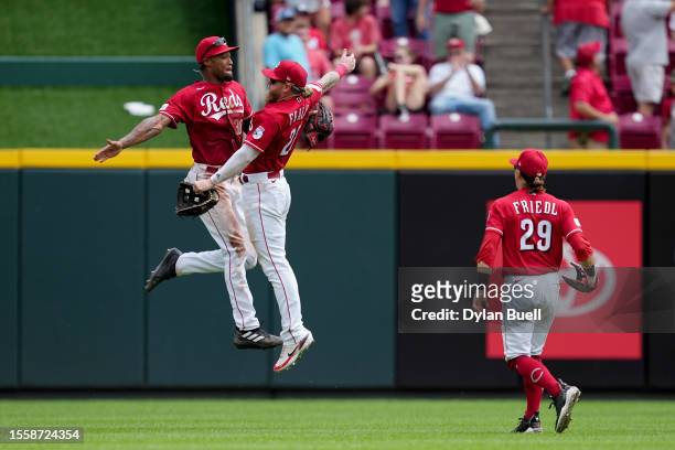 Will Benson, Jake Fraley, and TJ Friedl of the Cincinnati Reds celebrate after beating the San Francisco Giants 5-1 at Great American Ball Park on...