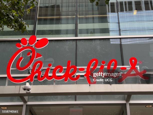 Chick Fil A logo and sign over restaurant, Manhattan, New York.