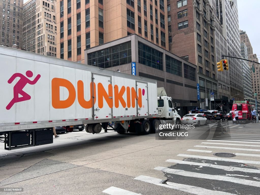 Large 18 wheeler Dunkin Donuts truck blocking the intersection sixth Large 18 wheeler Dunkin Donuts truck blocking the intersection sixth