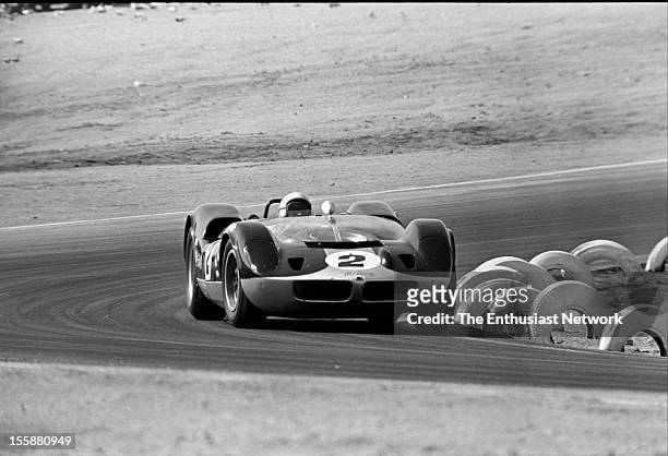 Times Grand Prix - Riverside. Bruce McLaren founder of McLaren racing driving his Oldsmobile powered McLaren Elva Mk1.
