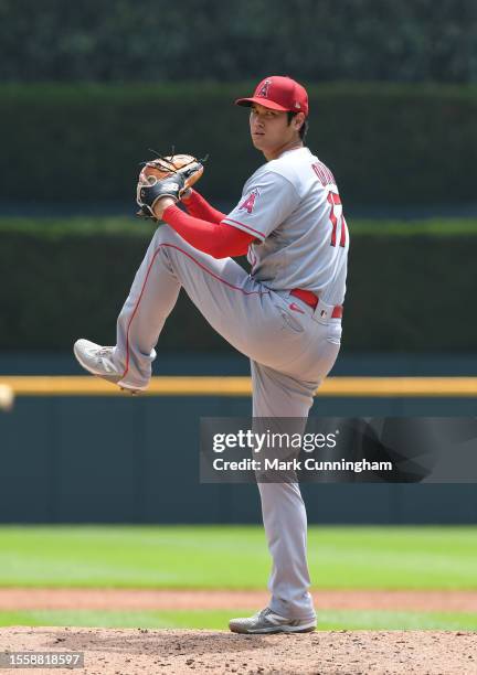 Shohei Ohtani of the Los Angeles Angels throws a warm-up pitch during the 3rd inning of game one of a doubleheader against the Detroit Tigers at...