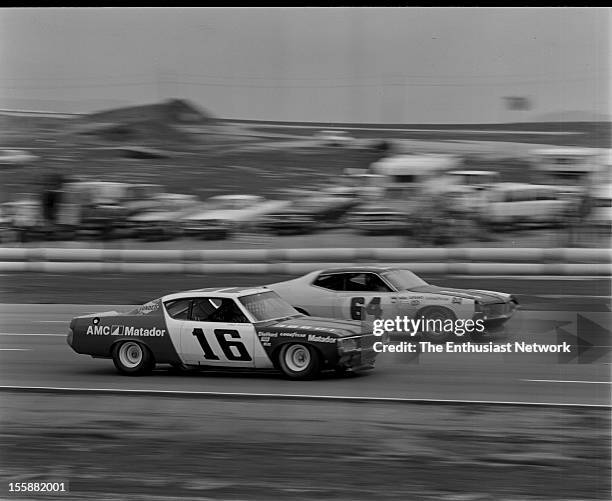 Winston Western 500. Race winner Mark Donohue on Penske racing drives his AMC Matador along the inside of Elmo Langley Ford Torino.