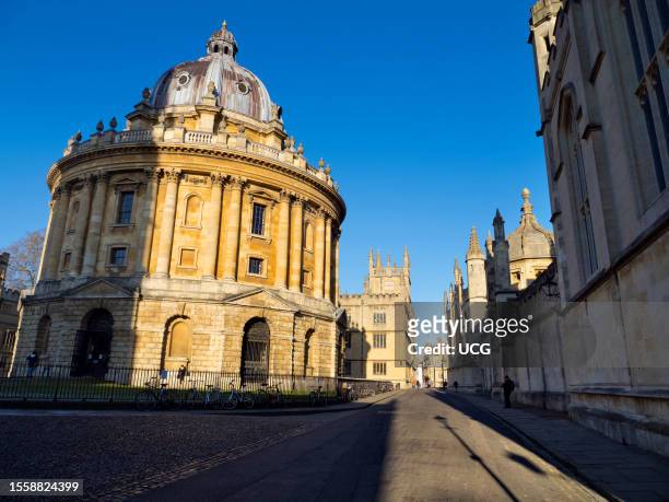 The Radcliffe Camera and St Mary's Church, Oxford, winter sunrise.