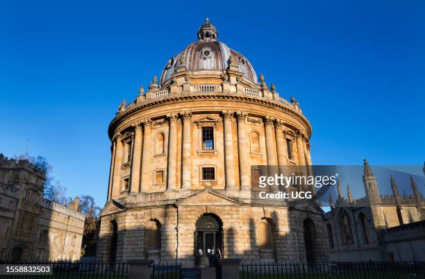 The Radcliffe Camera and St Mary's Church, Oxford, winter sunrise.