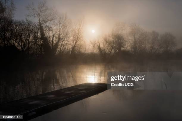 Winter sunrise and jetty on the Thames by Radley Boathouse.