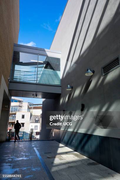 Walkway, shadows and silhouettes of the Westgate Centre in Oxford, England.