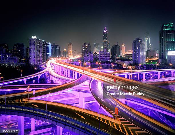 china, shanghai, road intersection at night - shanghai business stock-fotos und bilder