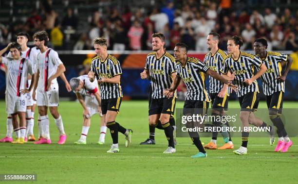 Juventus' players celebrate the match winning penalty by Argentine midfielder Matias Soule at the end of the penalty shootout during a pre-season...