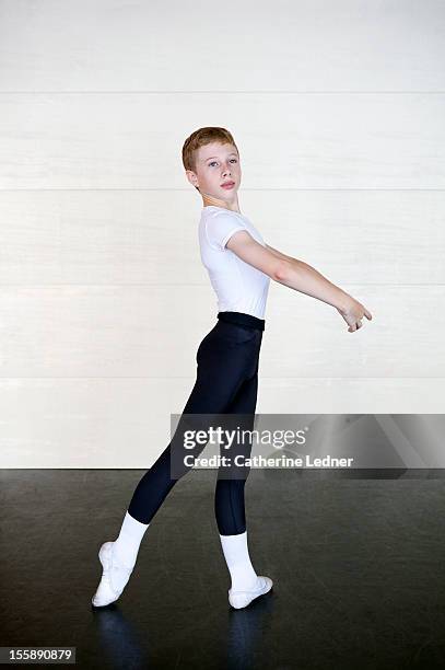 boy performing ballet poses - ballet boy stockfoto's en -beelden