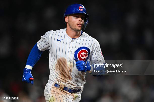 Nico Hoerner of the Chicago Cubs hits a grand slam in the eighth inning against the Washington Nationals at Wrigley Field on July 19, 2023 in...