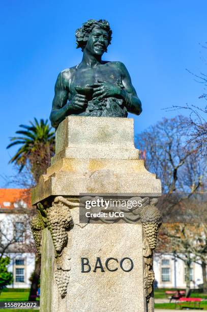 Porto, Portugal, Sculpture of Baco in the Square of the Portuguese Republic. Blue sky day in the famous place and tourist attraction.